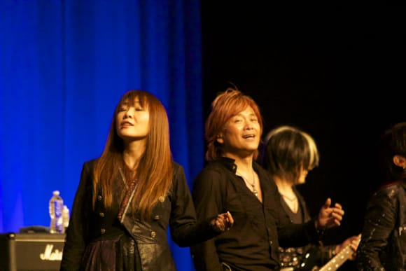 Masami Okui and Hironobu Kageyama. Okui-san is a prolific singer/songwriter with quite a few anime songs under her belt, including themes for Revolutionary Girl Utena and The Slayers.