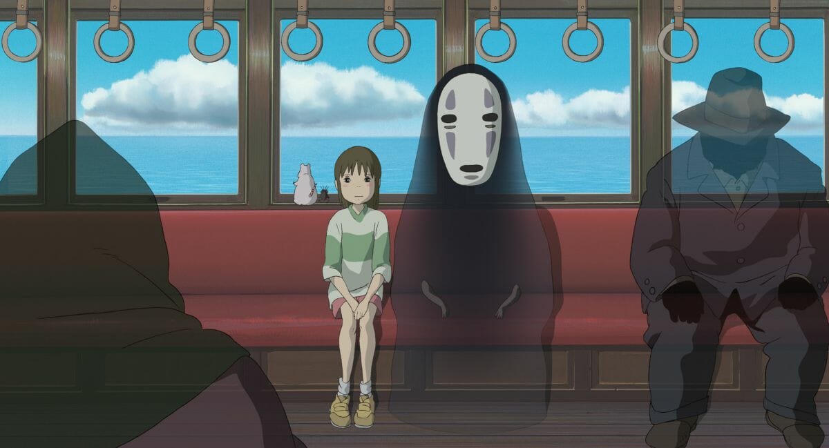 Spirited Away Still; Chihiro sits on a subway car with No Face