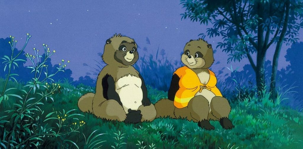 Screenshot from Pom Poko that depicts two tanuki sitting together on a grassy hill.