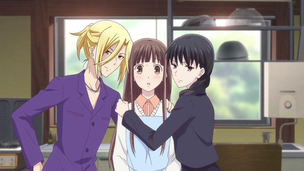 Fruits Basket (2019) Anime Still - Arisa Uotani and Saki Hanajima hug Tohru Honda