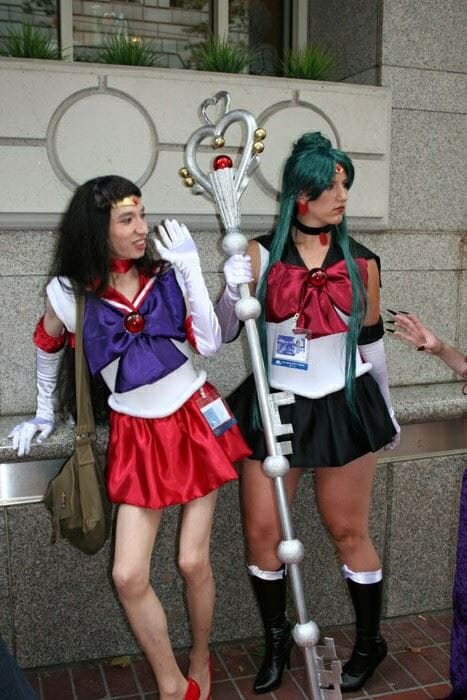 L.B. Bryant and another person cosplaying as Sailor Mars and Sailor Pluto, respectively