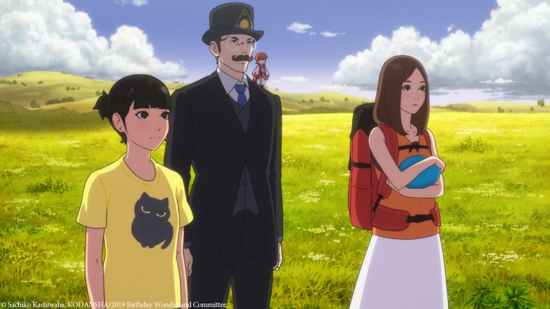 A woman in a yellow T-shirt, a woman in an orange blouse and white skirt, and a man dressed in a single-breast suit stand against a grassy plain at midday.