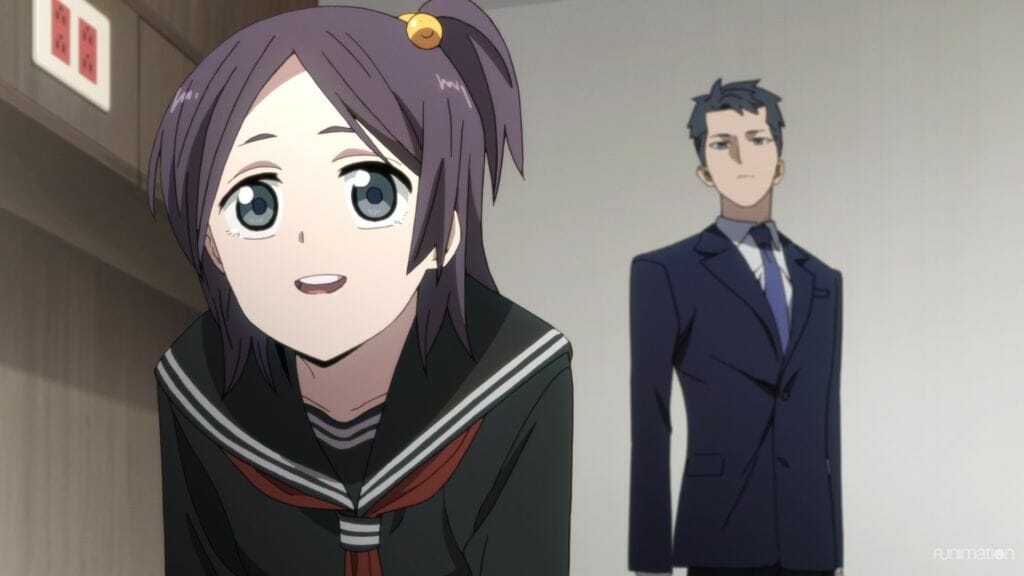 Id Invaded Episode 9 still - A girl with purple hair styled in a side-tail smiles at the camera. A man in a suit stands behind her.