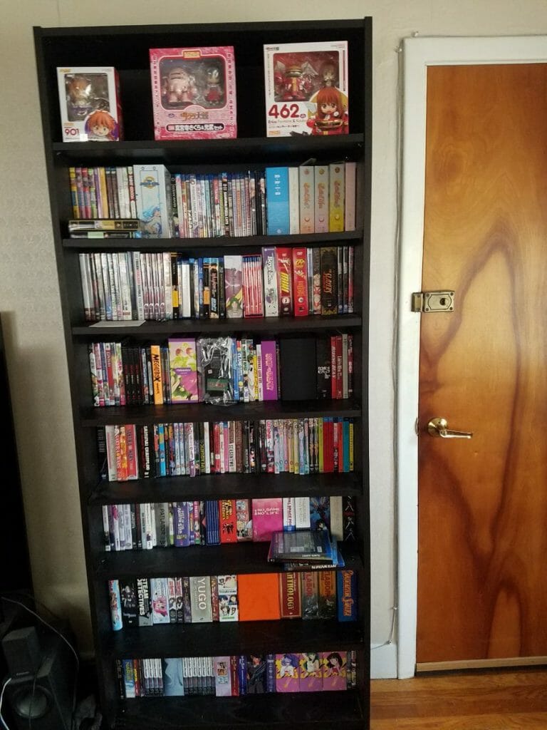 Photo of a large shelf filled with anime DVDs.
