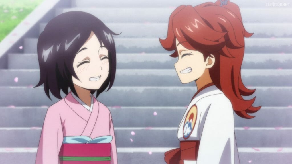 Sakura Wars The Animation Episode 04 still - a brown-haired girl and a red-haired girl dressed in kimonos smile at each other.