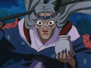 InuYasha anime still - an old woman clad in a kimono, wearing a headband.