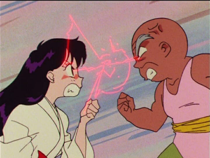 Sailor Moon anime still - A black-haired girl fights with a small, bald old man.