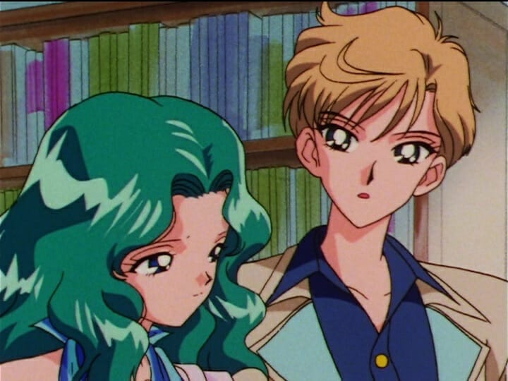 Sailor Moon anime still - a green-haired woman stands with a brown-haired woman.