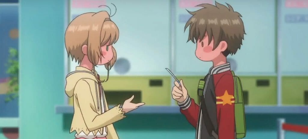 A brown-haired girl and a brown-haired boy blush as they gaze at each other awkwardly.