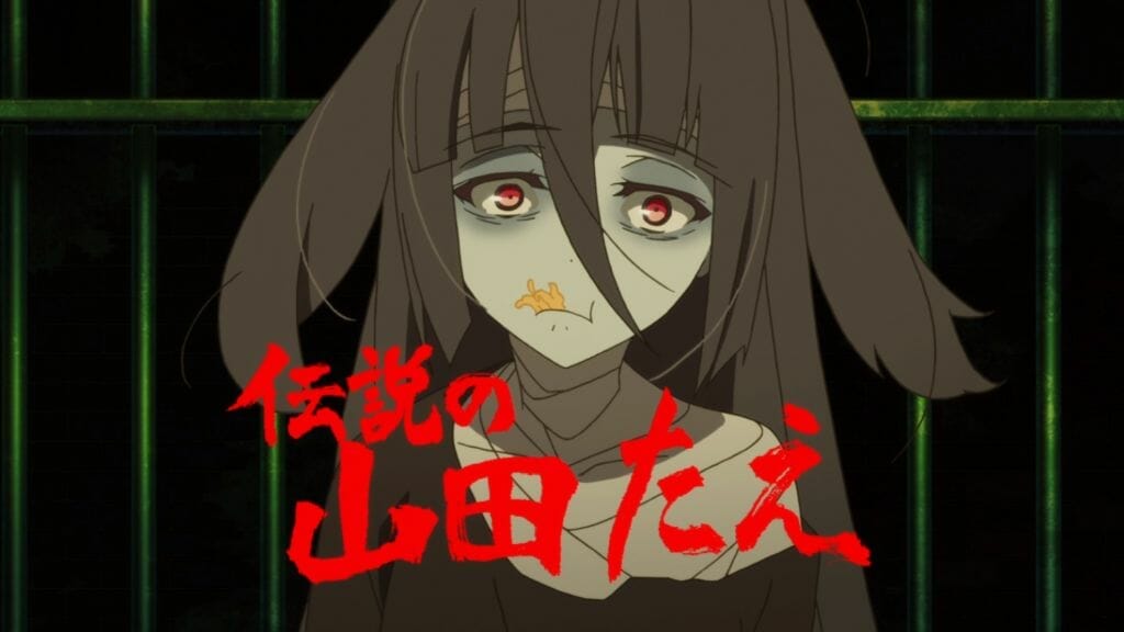 A black-haired zombie girl stares blankly as she gnaws on dried squid. The words "The Great Tae Yamada" are presented in red text below her face.