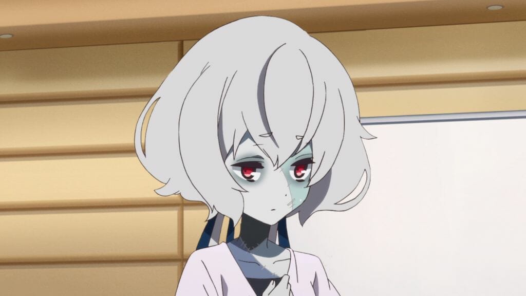 Still from Zombie Land Saga Episode 6, which depicts a head shot of a silver-haired zombie who is looking down with a sad expression.