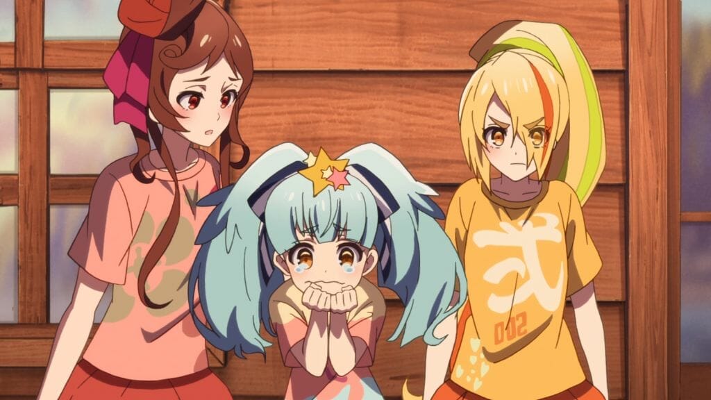 Still from Zombie Land Saga Episode 6, which depicts a crying girl with blue hair, an angry blonde woman, and a concerned brunette woman.