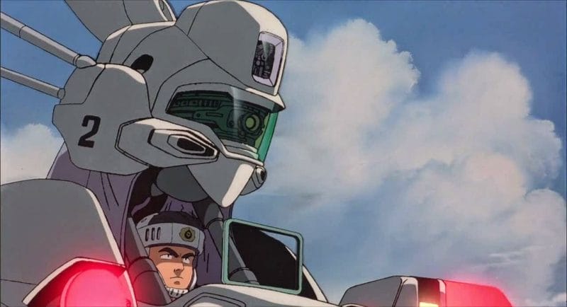 Still from Patlabor 2, which features a man piloting an Ingram mecha.
