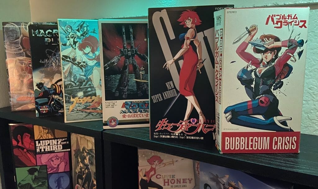 Photograph of anime VHS tapes arranged on a shelf.