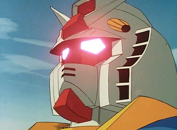 The head of a Gundam Mobile Suit, with glowing red eyes.
