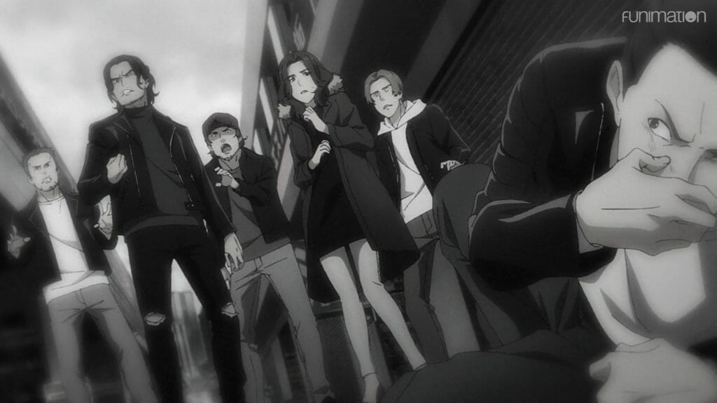 still from Ikebukuro West Gate Park episode 4, depicting a black and white scene of a gang of people standing over a man who is holding his mouth and glaring angrily.