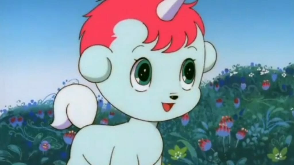 Still of anime character Unico: a blue unicorn with a short pink mane.