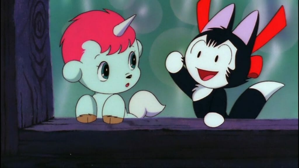 The Fantastic Adventures of Unico that features Unico, a blue unicorn, looking curiously at a black and white cat named Katy.