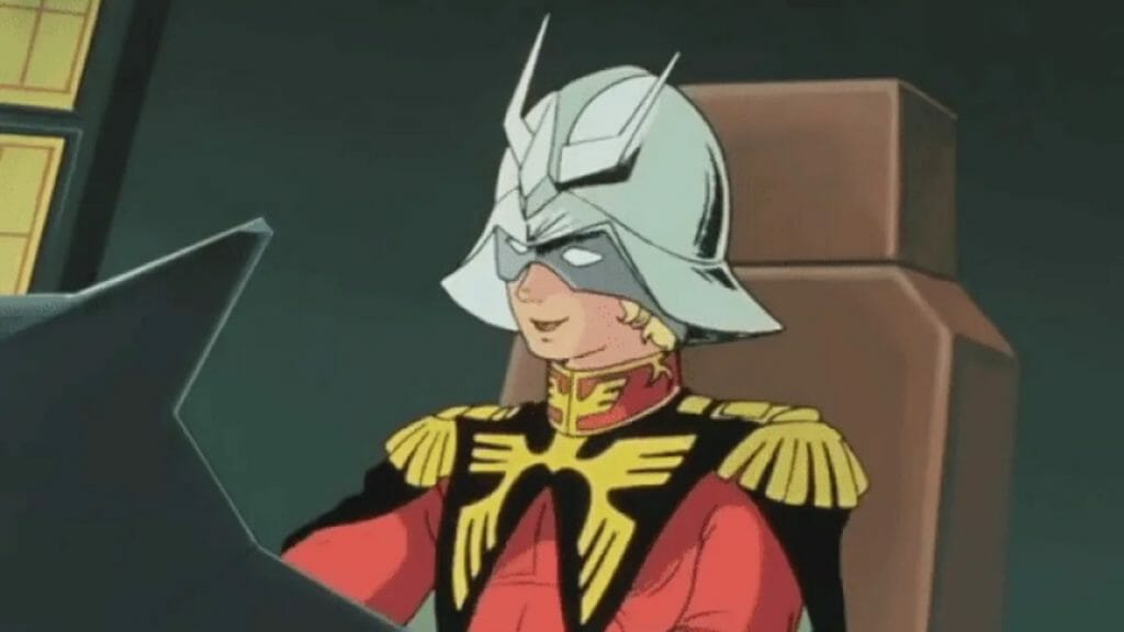 Upper body shot of Char Aznable, a blonde man in a silver helmet and a red-and-gold military uniform. He smiles as he looks off to the left.
