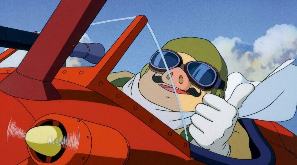 Still from Porco Rosso depicting a man with a pig-head seated in the cockpit of an airplane. He smiles as he gives a thumbs up.