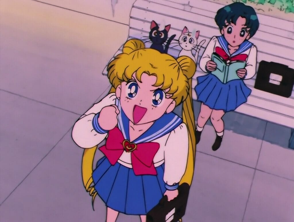 Usagi looking upwards towards the camera with a determined expression, clutching her hand in front of her chest