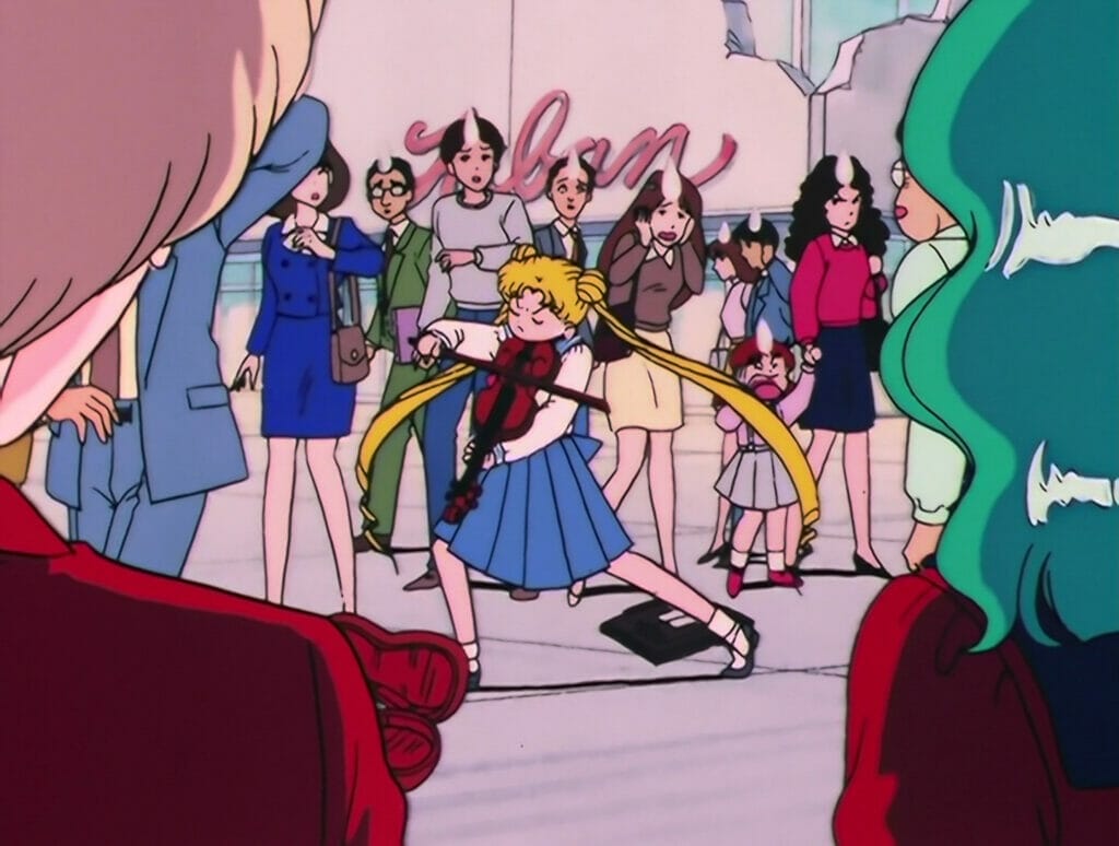 Usagi attempting to play the violin in front of a crowd of shoppers, striking a dramatic pose