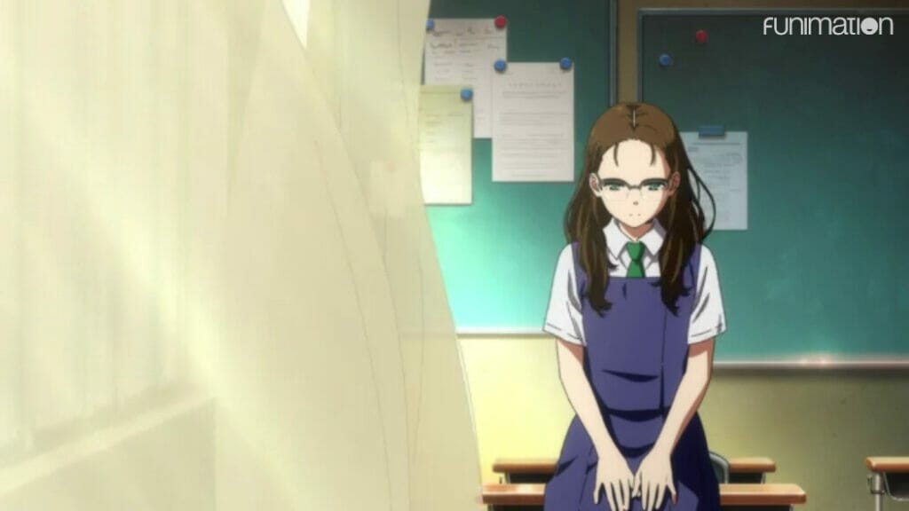 A girl sitting at a desk in a classroom, a pale curtain billowing across half the frame and nearly touching her
