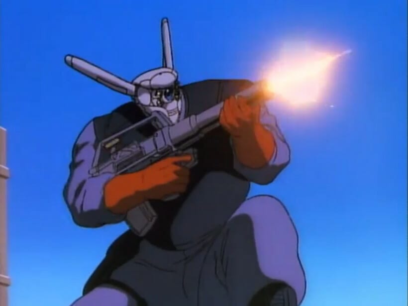 A giant robot crouches as it fires a rifle offscreen.