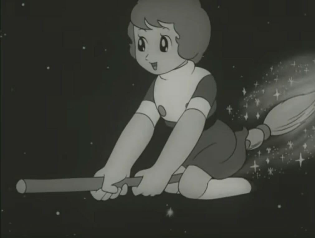 Black-and-white screencap from Sally the Witch showing a small girl riding a broomstick