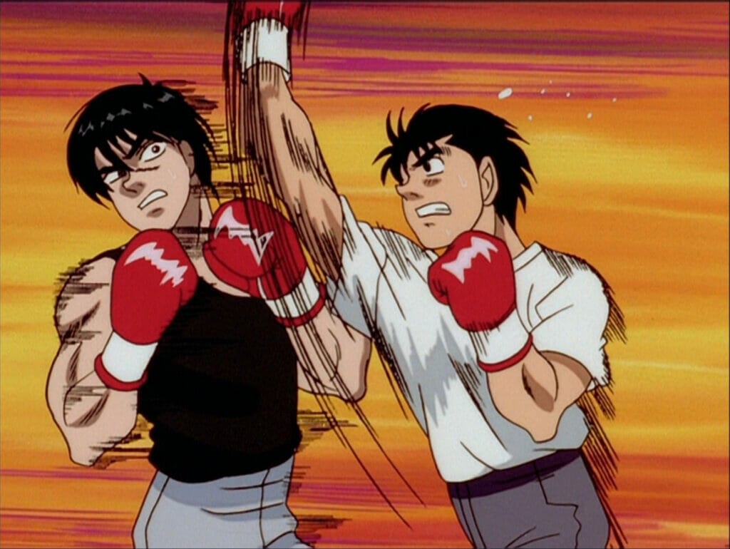 Screenshot from Hajime no Ippo, in which a man in a T-shirt and grey sweats delivers an uppercut to a man in a black tank top.