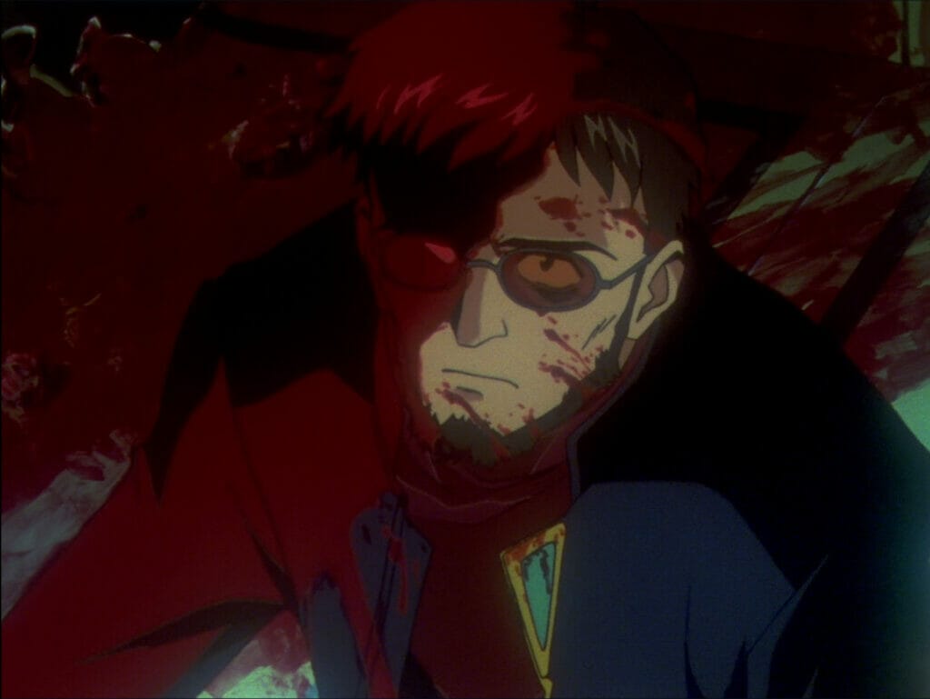 Gendo Ikari stares up at the camera with a scowl. He's covered in blood, which covers the right side of his body.