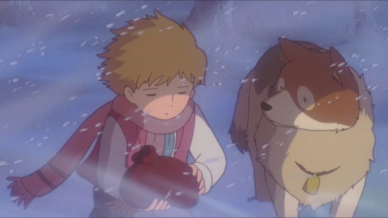 Still from Dog of Flanders featuring a small child and a dog in the snow