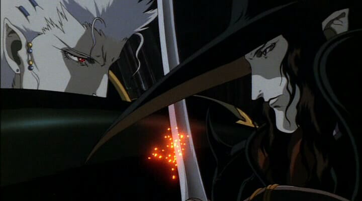 A vampire with spiky hair and a man in a wide-brimmed hat stare at one another in a close-up as their swords clash together.