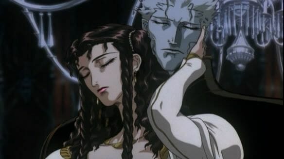 Still from Vampire Hunter D: Bloodlust, which portrays a brunette human woman in the embrace of an ashen-faced vampire.