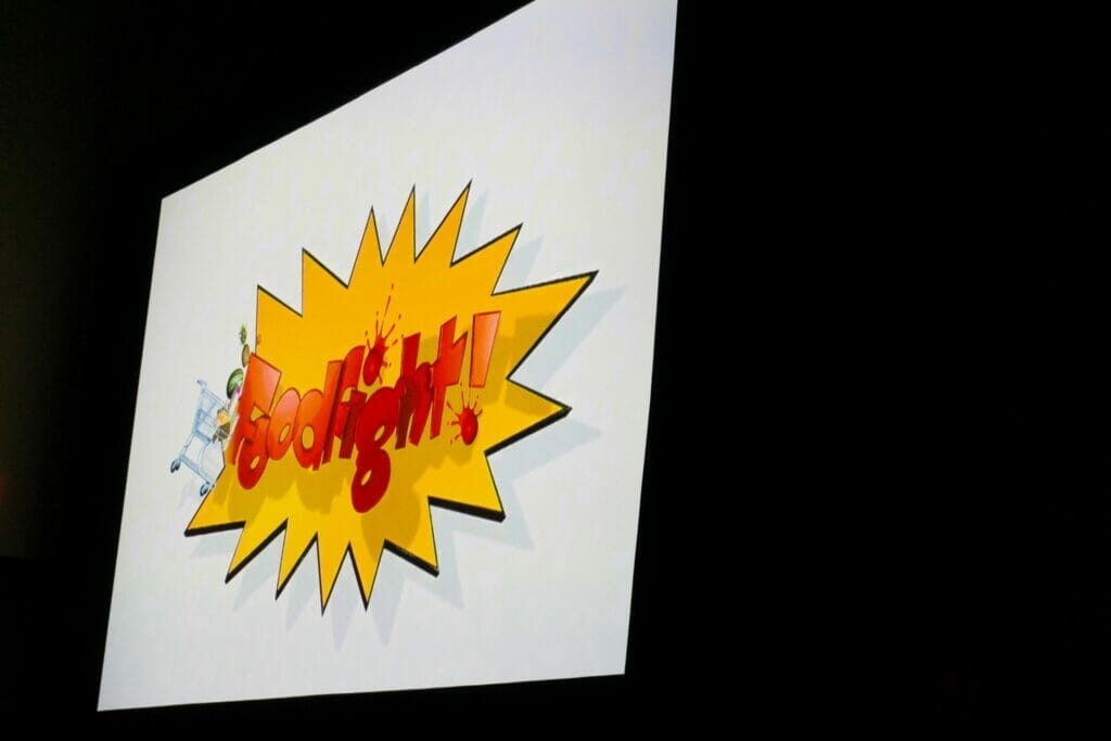 Photo of a screen with the text "FOODFIGHT!" projected on it
