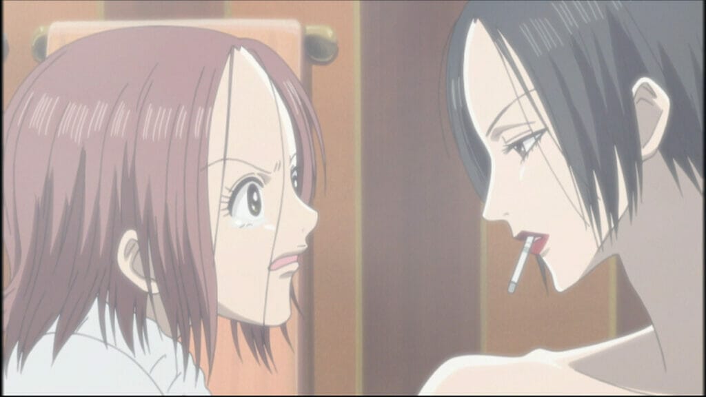 Still from the Nana anime, which depicts a brown-haired woman crying at a black-haired woman who is smoking a cigarette