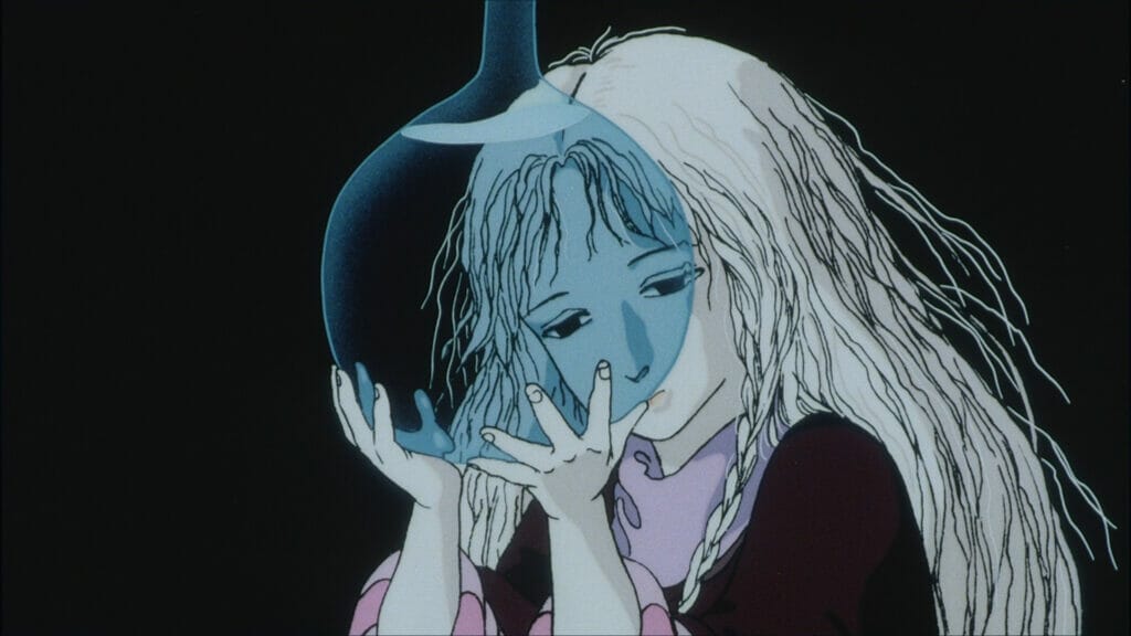 Still from Angel's Egg. A sullen blonde girl wearing a cloak and a pink, striped shirt stares through a clear container of water.