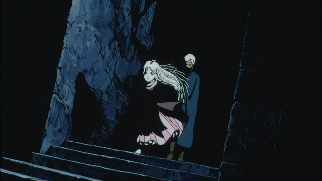 Still from Angel's Egg. A blonde girl in a pink dress and brown cloak runs downstairs ahead of a white-haired man in a green cloak.