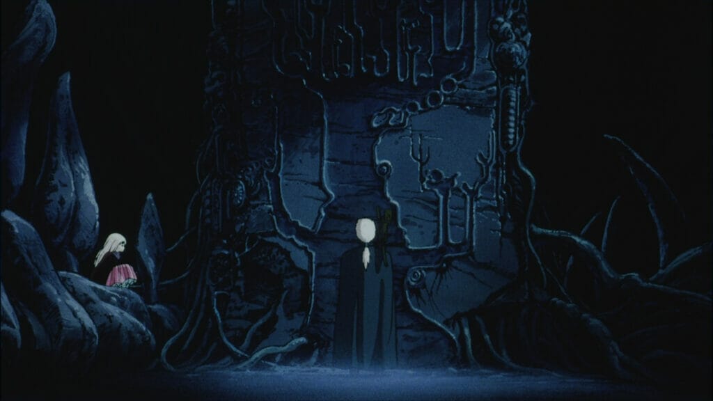 Still from Angel's Egg. A white-haired man in a blue-green cloak stares at a massive wall engraving.