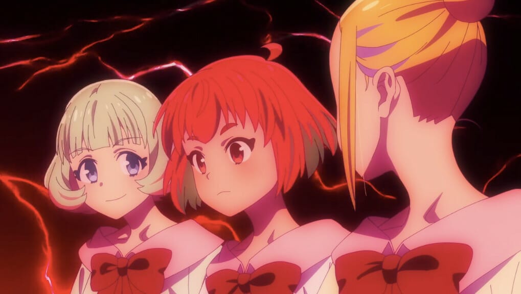Closeup of the three main Healer Girls, looking determined under a red glow