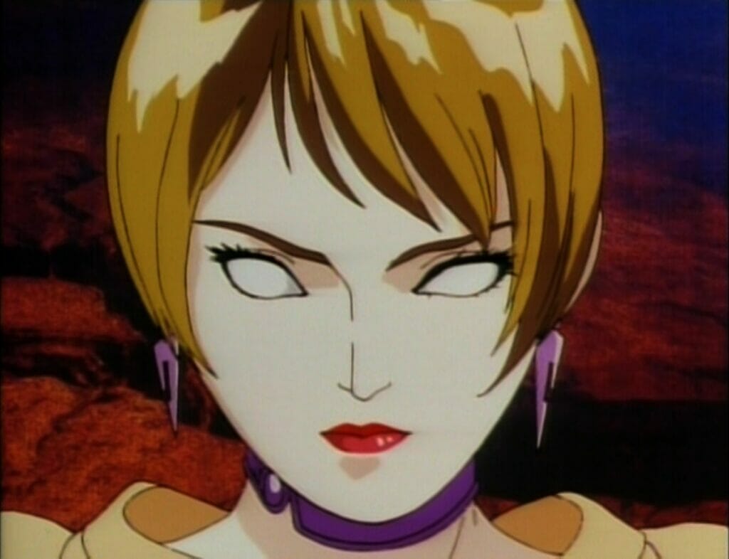Screenshot from Genocyber. A woman with short brown hair cut in a bob glares at the camera. Her eyes have no pupils.