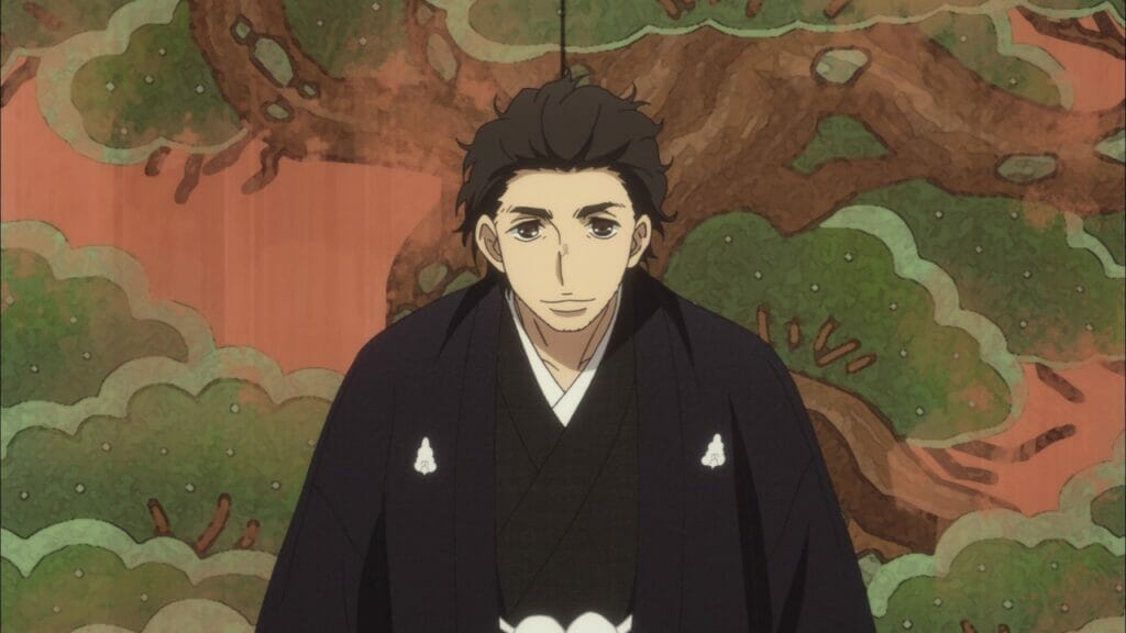 Screenshot from Descending Stories Showa Genroku Rakugo Shinju, which depicts a dark-haired man in a black kimono as he sits before a colorful screen.