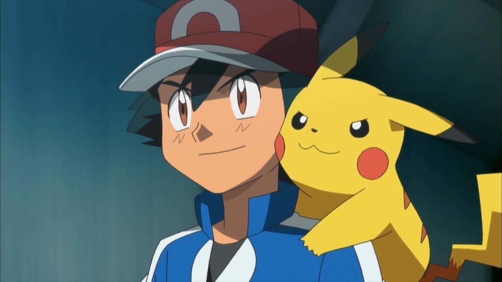 Ash Ketchum - a boy with shaggy black hair and a red baseball cap, grins confidently as he looks offscreen. Pikachu - a yellow electric mouse creature - is perched on his shoulder.