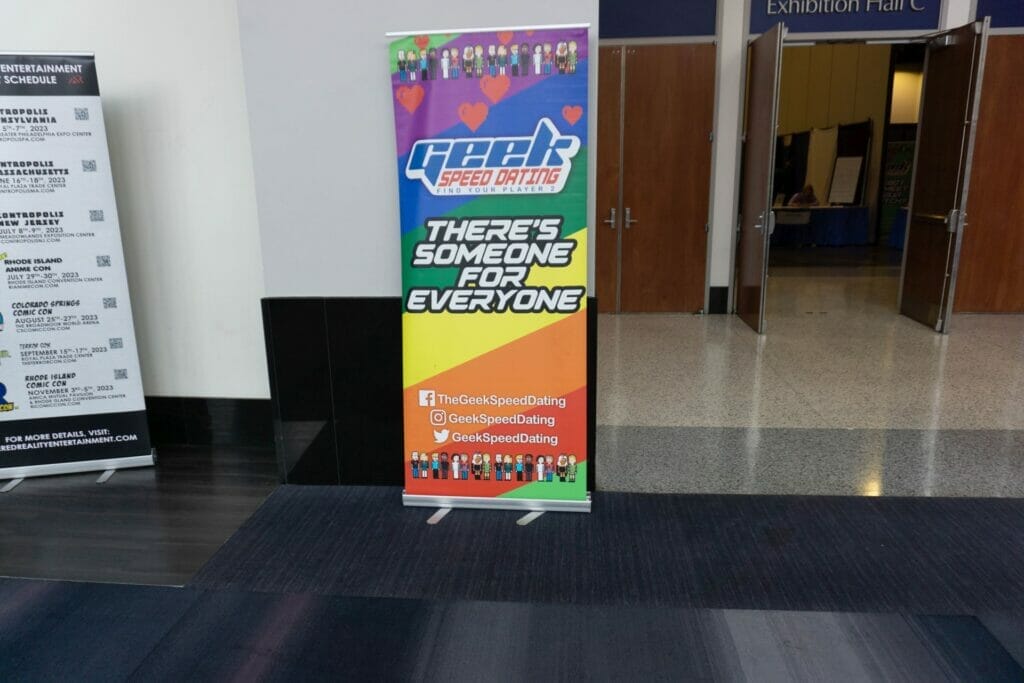 Photo from RI Anime Con of a sign advertising "Geek Speed Dating."