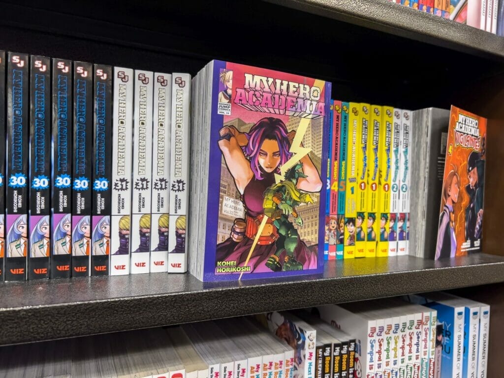 A close-up photo of several manga books arranged in a row, with a volume of My Hero Academia faced toward the camera.