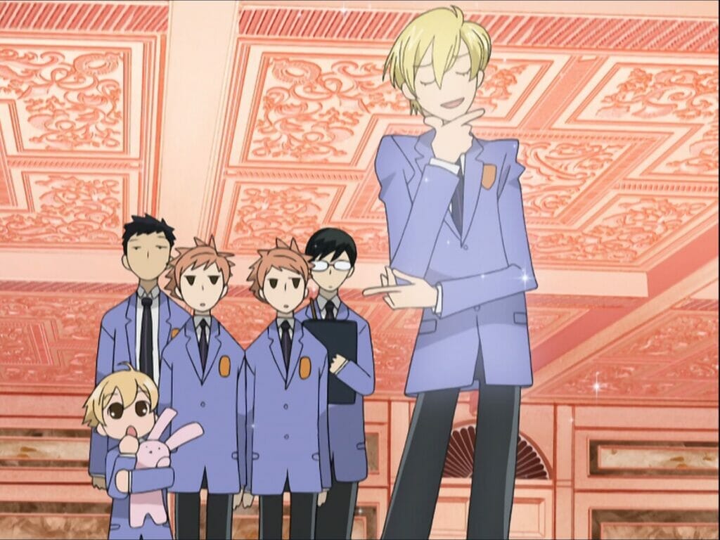 Screenshot from Ouran High School Host Club - A blonde student stands, thoughtfully, as five onlookers watch skeptically from behind.