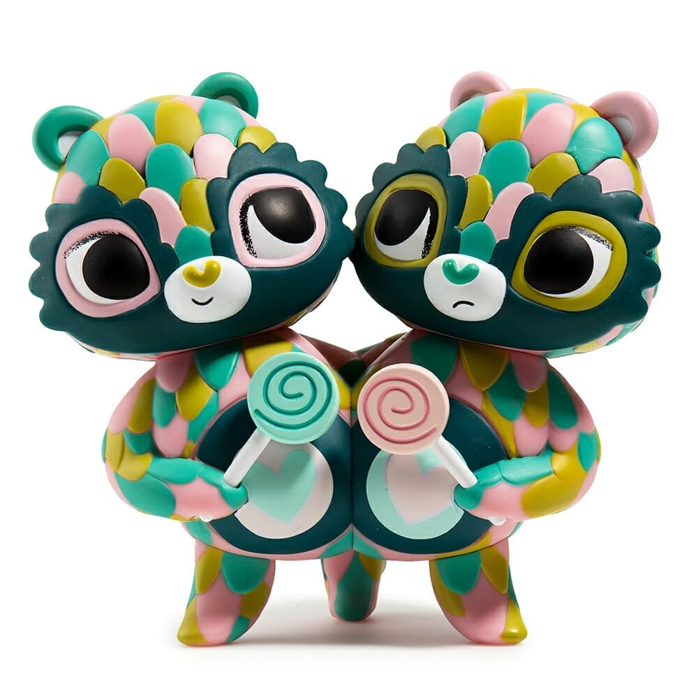 Photo of Share Bear - a Kidrobot toy featuring two multicolored bears conjoined at the hip. They're both holding lollipops.