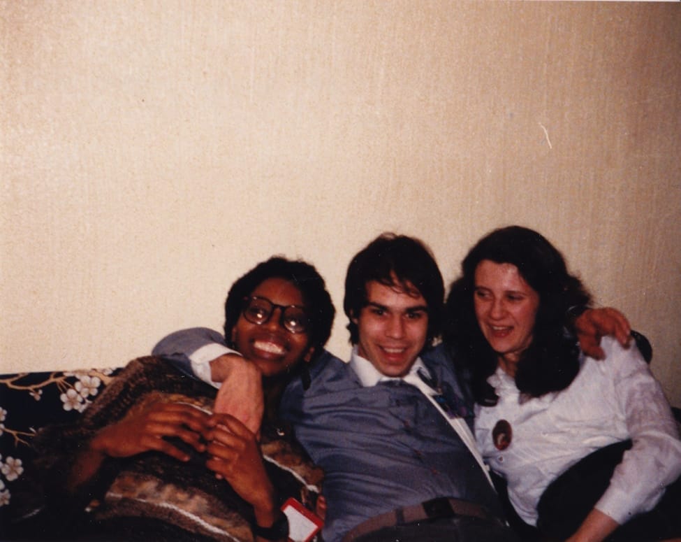 A photograph of Beverly Headley, Robert Fenelon, and Patricia Malone reclining together on a couch