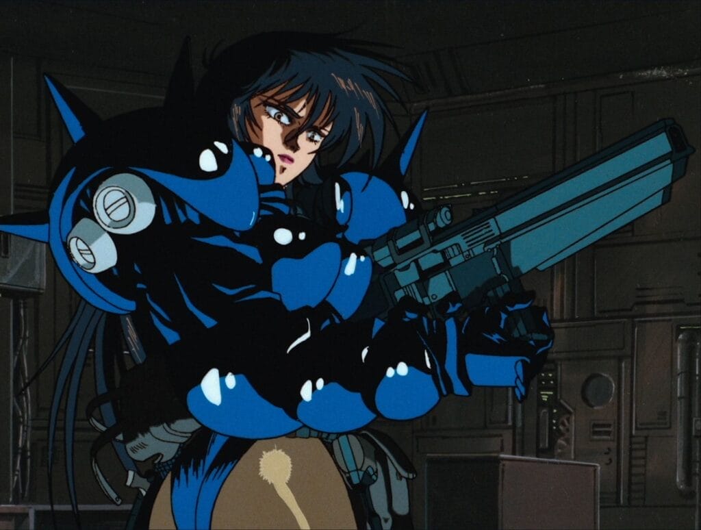 Screenshot from Angel Cop that depicts the titular Angel, a raven-haired woman wearing blue body armor that covers her upper body but leaves her bottom half exposed in a form-fitting leotard. She's cocking a giant laser gun as she inexplicably turns her butt toward the camera.