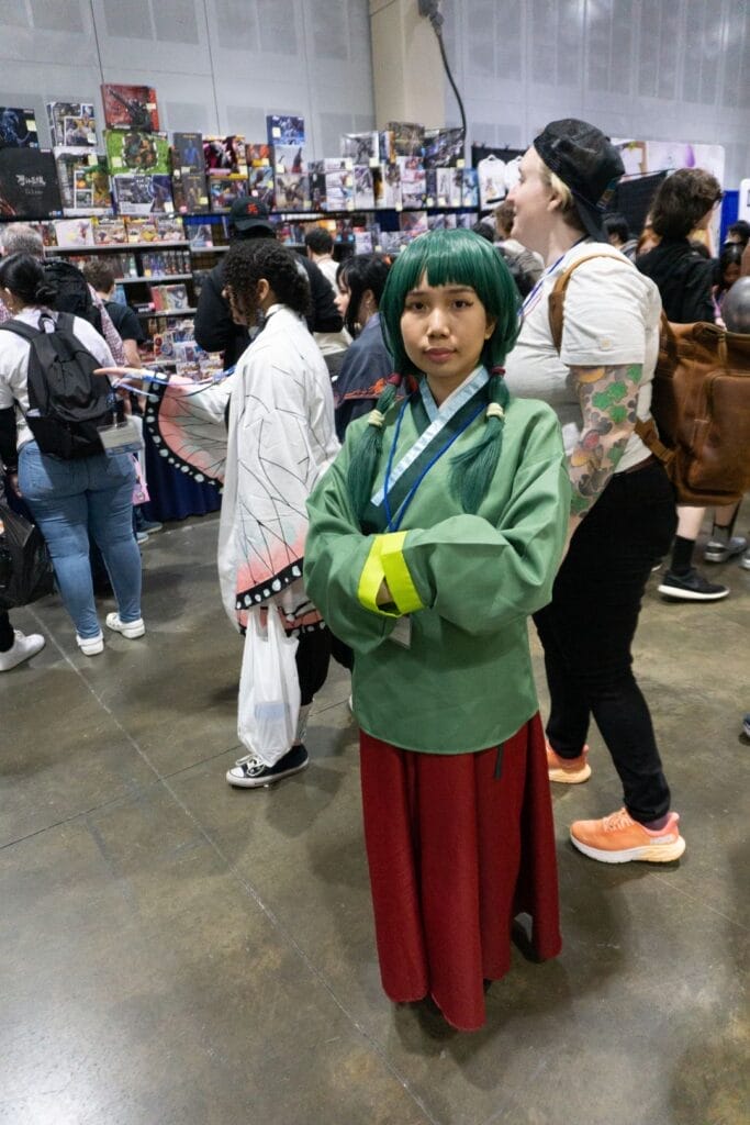 Photo of a cosplayer dressed as Maomao from The Apothecary Diaries